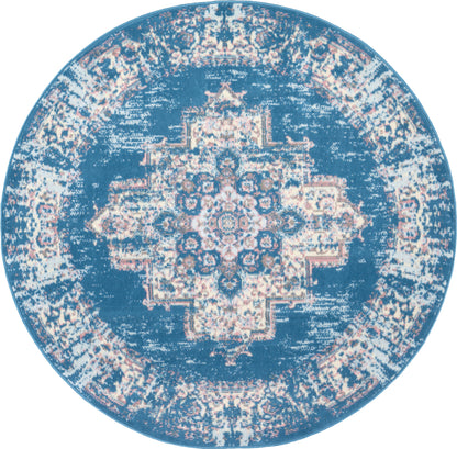 Round blue distressed rug with cream central medallion and ornate border.