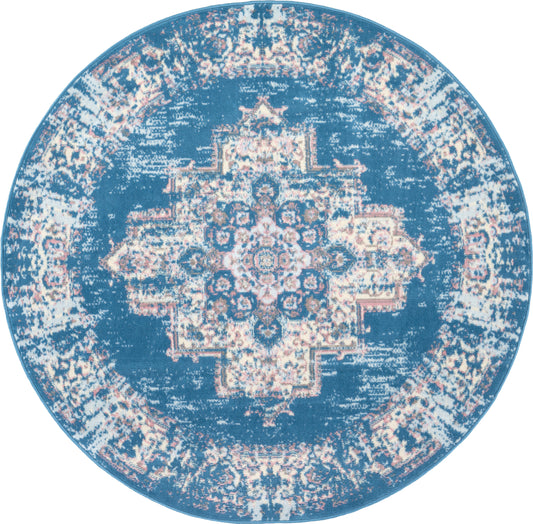 Round blue distressed rug with cream central medallion and ornate border.
