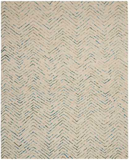 Beige rug with a subtle blue-gray chevron pattern and a soft woven texture.