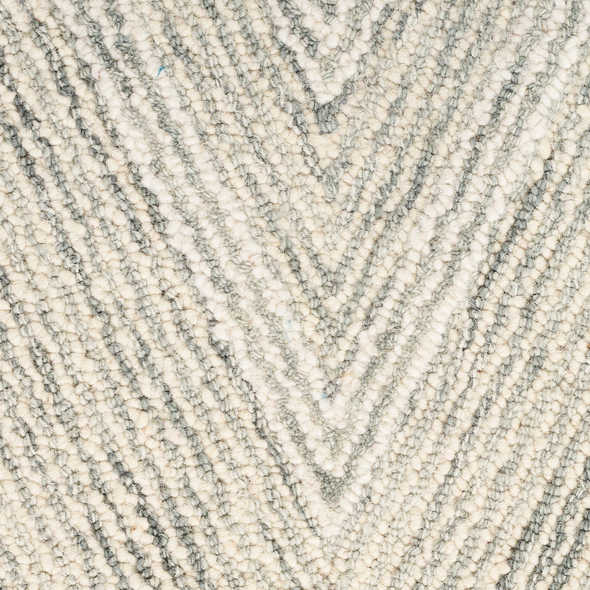 Cream and gray textured rug with a chevron diamond pattern and soft boucle pile.