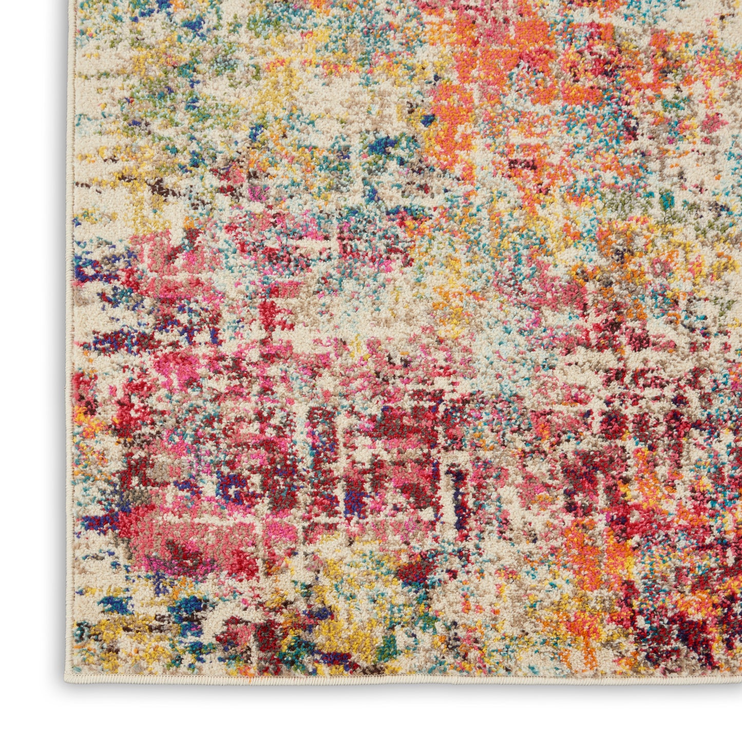 Colorful abstract shag rug with beige base and bright pink, yellow, blue, and red splashes; textured pile.