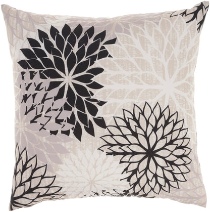 Beige square throw pillow featuring large black floral mandala designs against a pale leaf-patterned backdrop