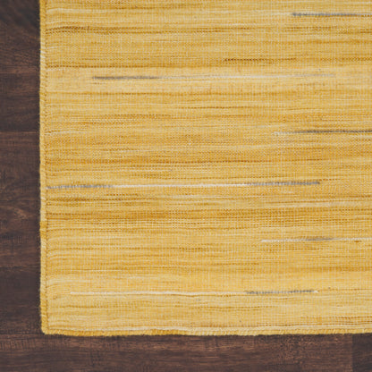 Yellow flat-weave rug with pale horizontal stripes on a dark wood floor.