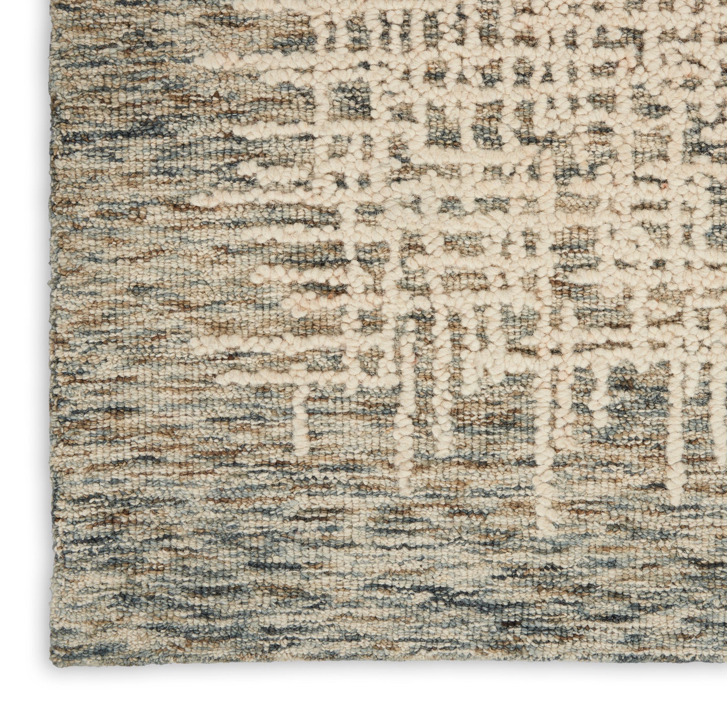 Soft, textured area rug in cream, beige and blue-gray with an abstract geometric pattern for living room decor.