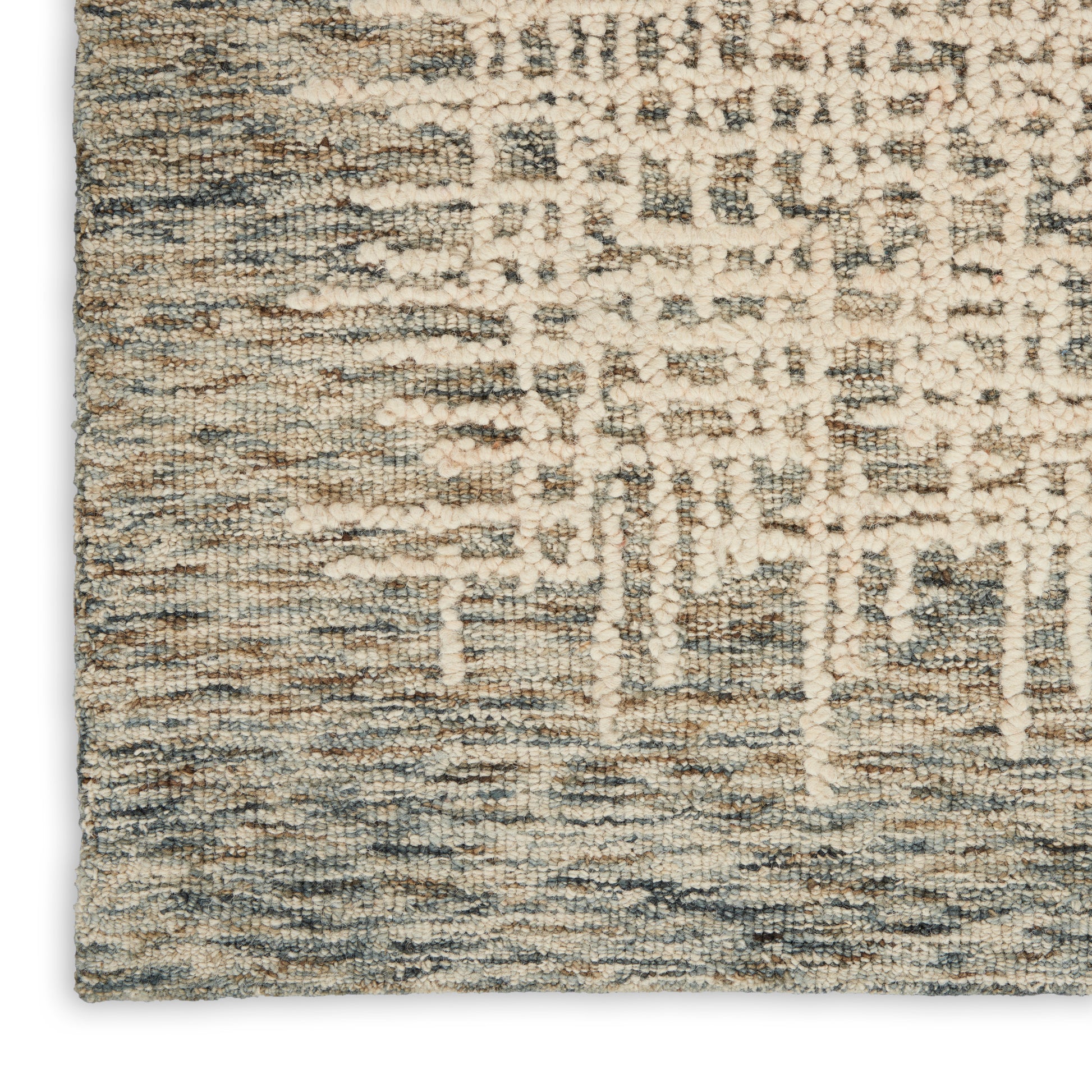 Soft, textured area rug in cream, beige and blue-gray with an abstract geometric pattern for living room decor.