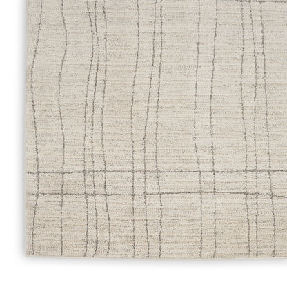 Cream rug with taupe vertical and horizontal lines forming a plaid grid, soft textured pile.