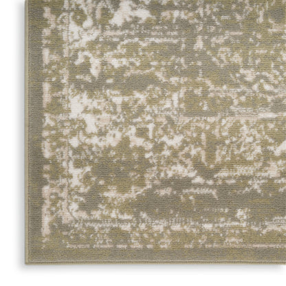Olive and cream distressed-pattern rug close-up, low-pile with ornate vintage motif and light border.