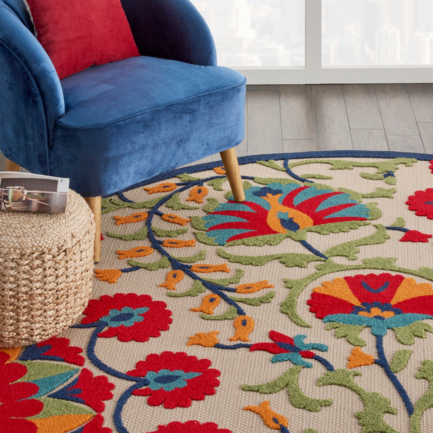 Round rug with a vibrant floral pattern; 8' diameter.