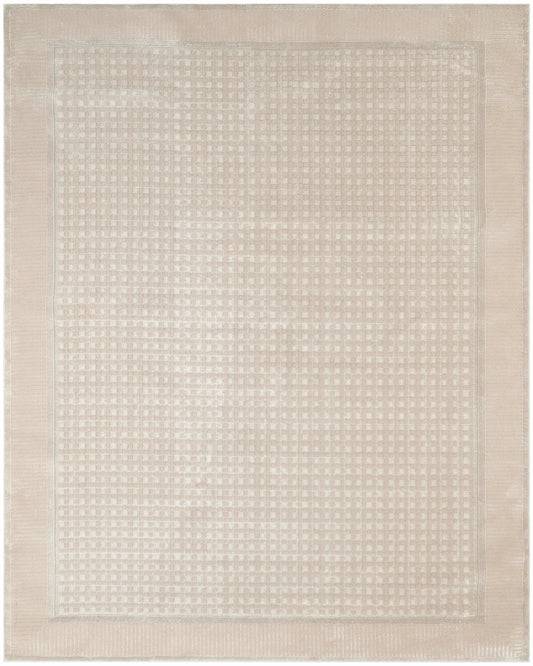 Beige rectangular woven rug with a subtle square-dot pattern and double border; neutral, cozy, versatile decor piece.