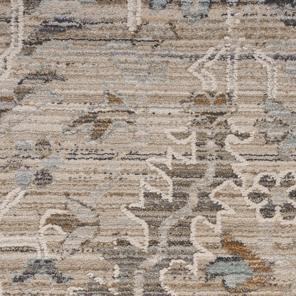 Distressed beige and gray oriental rug with abstract floral motifs and muted blue accents.