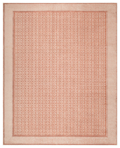 Rectangular coral woven rug with a dotted grid interior and striped border for a modern look.