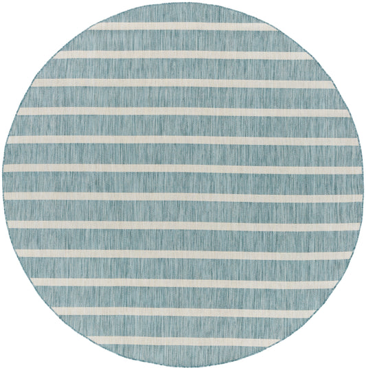 Circular blue woven rug with off-white horizontal stripes; coastal style, soft texture, ideal for living room or patio.