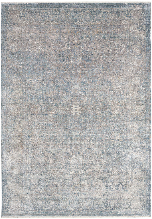 Rectangular distressed blue-gray rug with ivory floral medallions; Persian-inspired ornate border, vintage look.