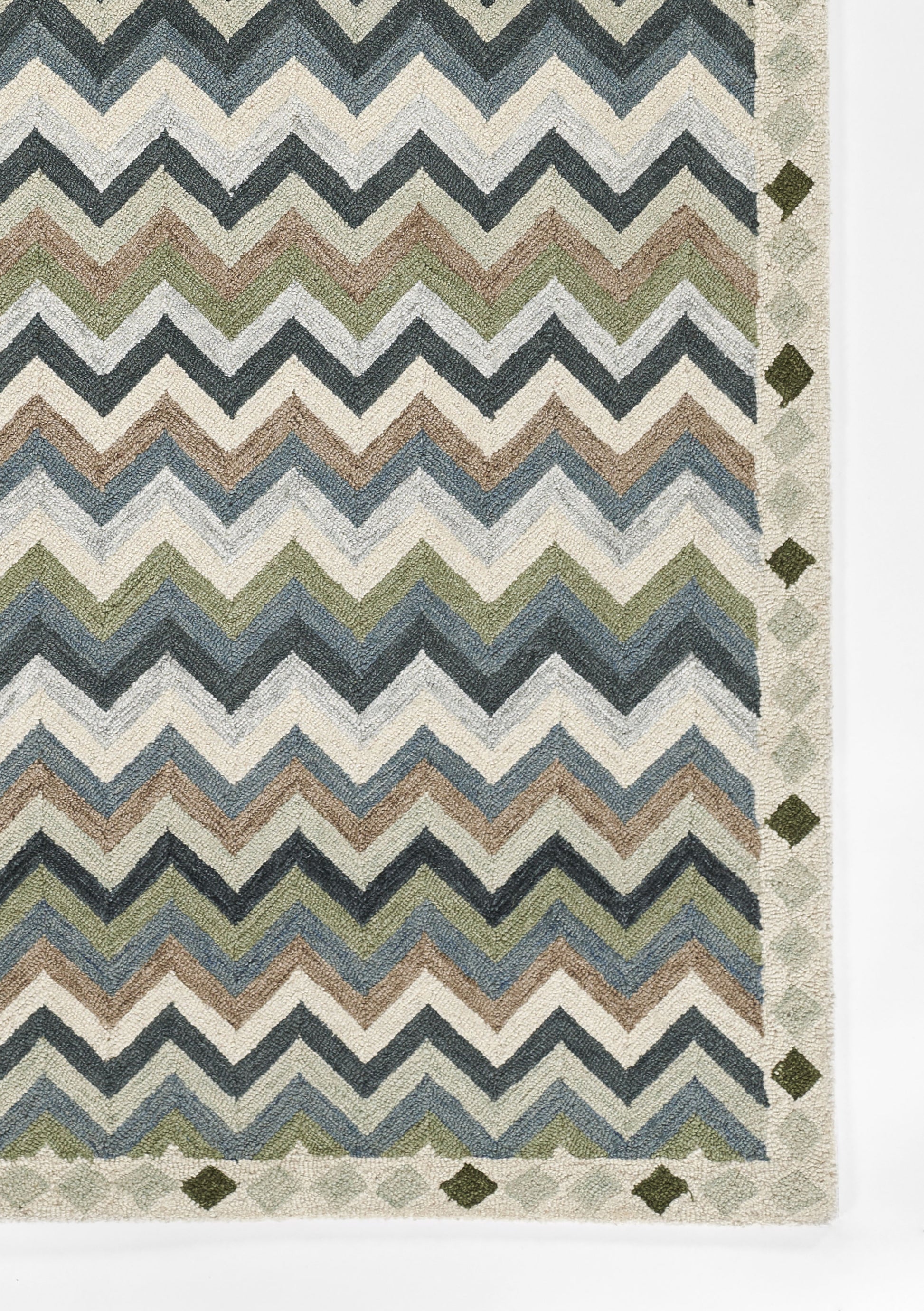Multicolor chevron rug with blues, greens, taupe and cream; geometric border with diamond motifs, woven textile.