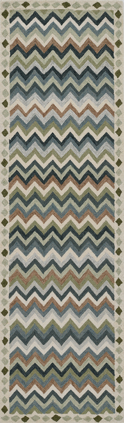 Woven textile runner with multicolor chevron zigzags in blues, teals, browns and creams; bordered edges.