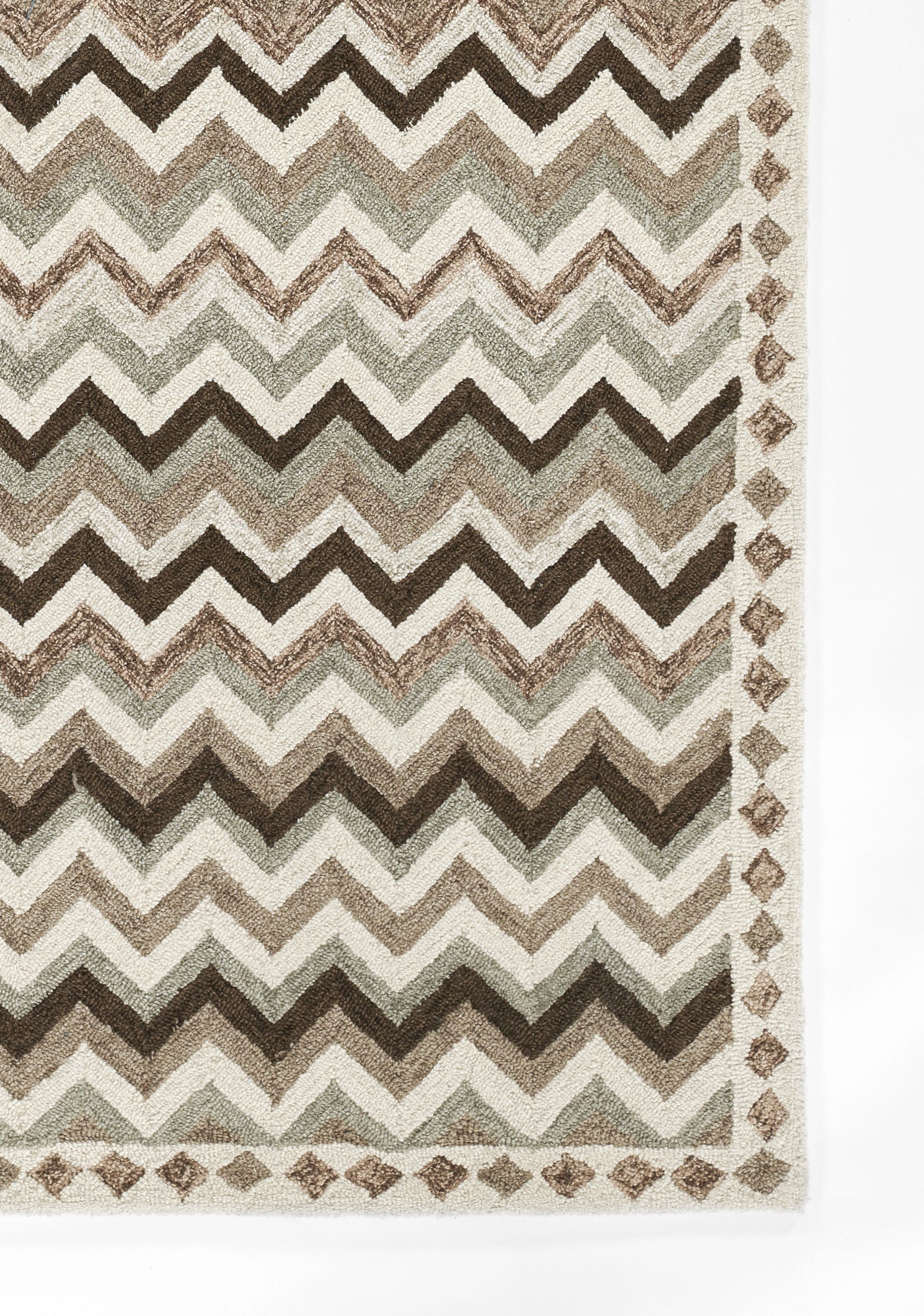 Chevron-pattern rug in beige, taupe, sage and brown with a diamond border and textured zigzags.