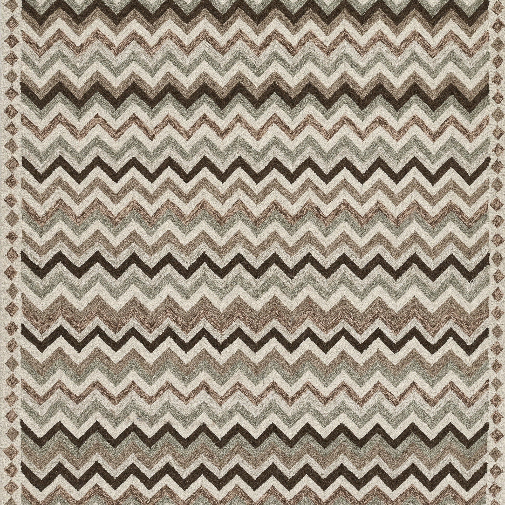 Rectangular woven rug in neutral browns, beiges and grays with a bold zigzag chevron pattern.