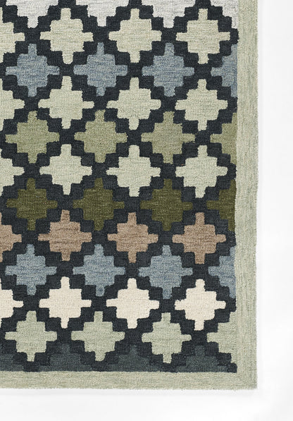Woven area rug with a repeating diamond trellis pattern in cream, navy, blue-gray, greens and browns; pale sage border.