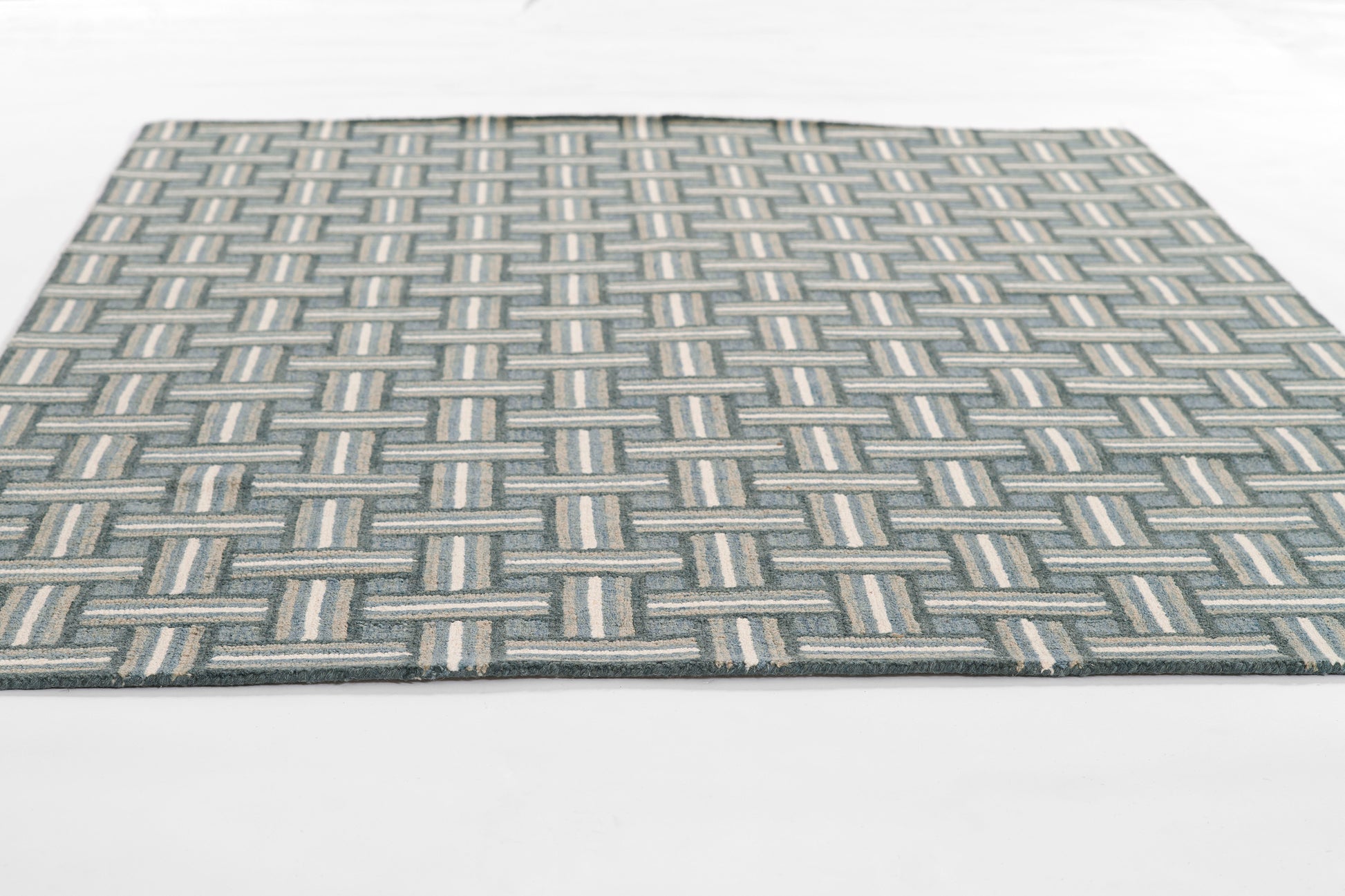Rectangular blue-gray geometric woven area rug with cream accents; modern basket weave.
