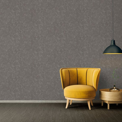 Distressed geometric motif wallpaper in silver grey on a wall.