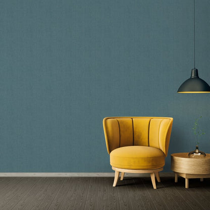 Blue Hessian-effect textured wallpaper with a woven pattern.