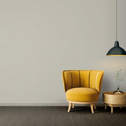 Mustard yellow velvet accent chair with vertical channel tufting and wooden legs in a mid-century modern living room.