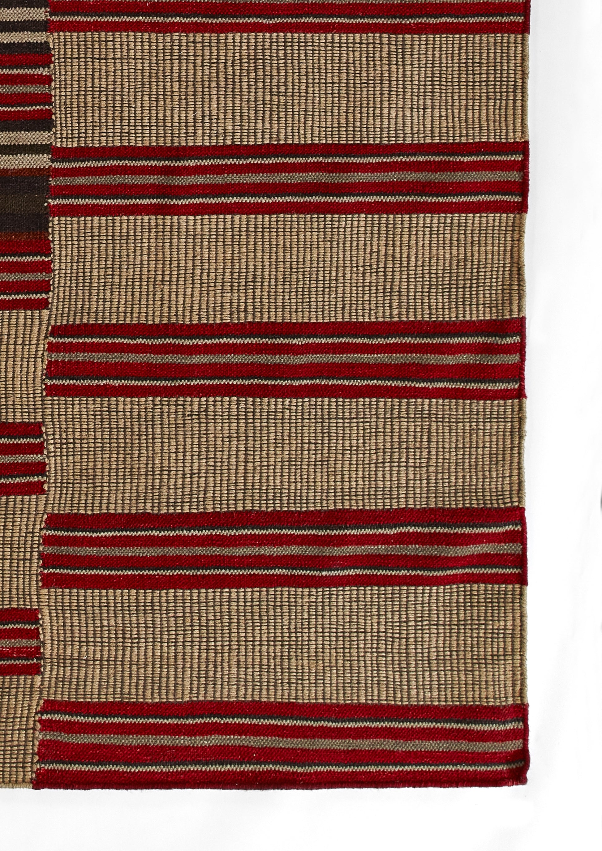 Handwoven beige rug with bold red horizontal stripes and narrow red accents; rustic woven textile.