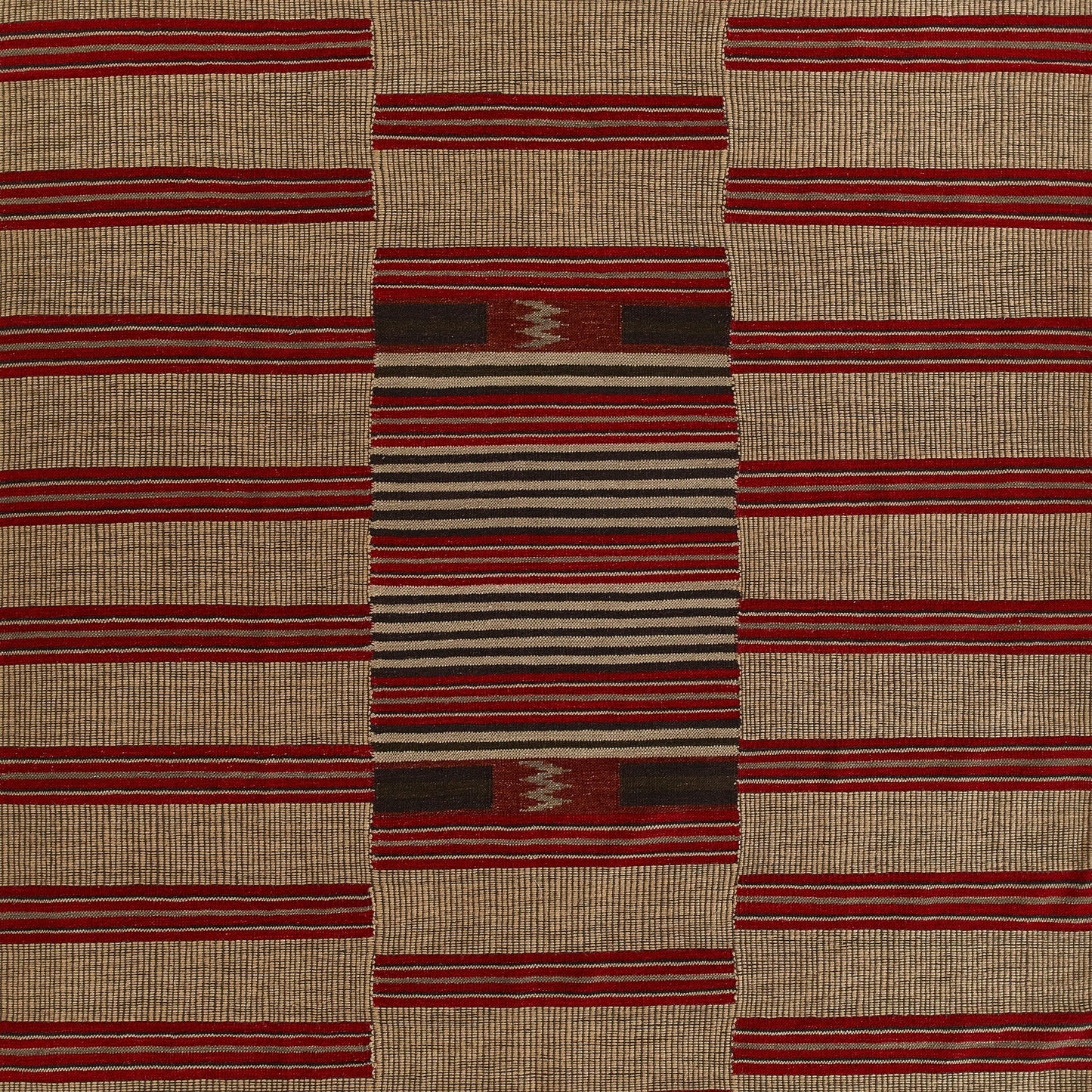 Woven beige area rug with bold red stripe pattern and a central multicolor striped panel; geometric textile.