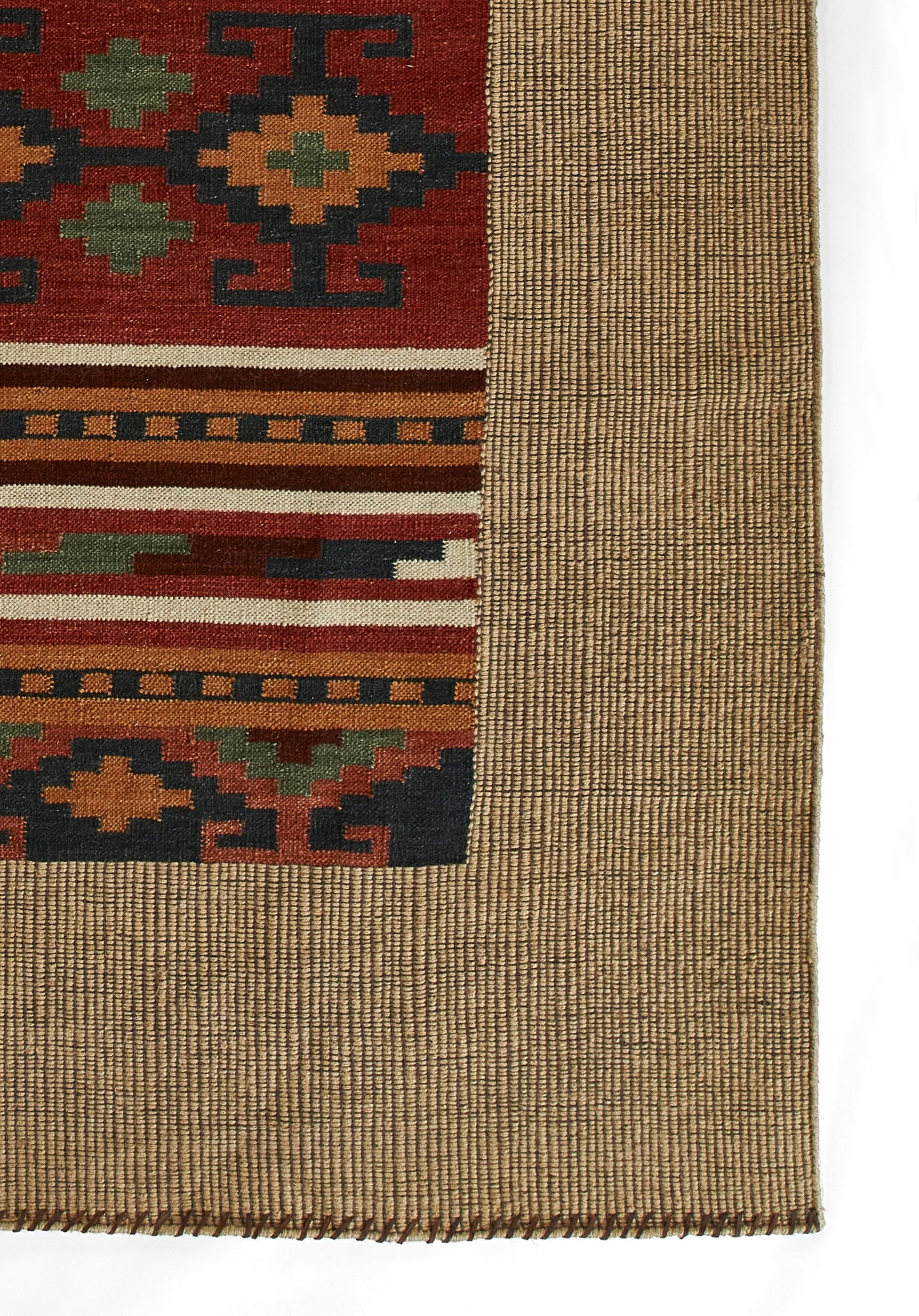 Geometric kilim rug with red field, green and blue motifs, tan and orange striped bands, and natural beige border.