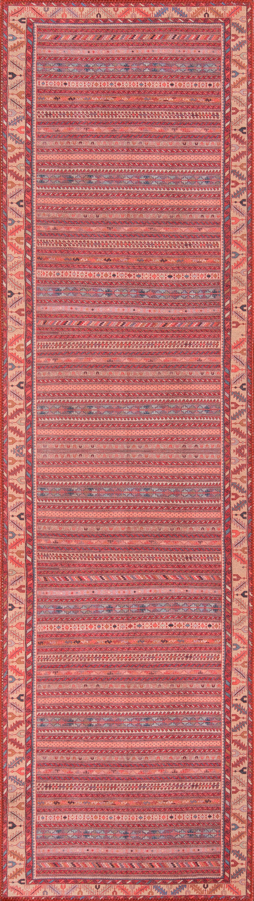 Pink woven rug with red and blue geometric stripes and a decorative border.