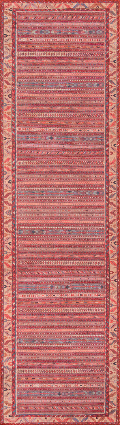 Pink woven rug with red and blue geometric stripes and a decorative border.