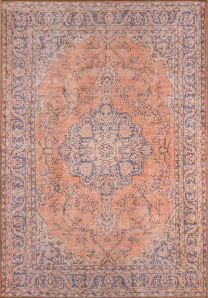 Rectangular Persian-style rug with peach field, blue border, central medallion and floral vines; vintage look.