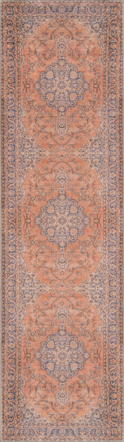 Peach-orange oriental area rug with blue-gray central medallions and scrolling floral border.