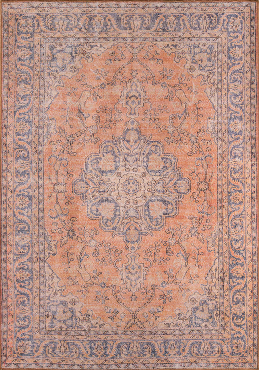 Persian-style Oriental rug with peach-orange field, blue central medallion, and intricate blue-cream border.