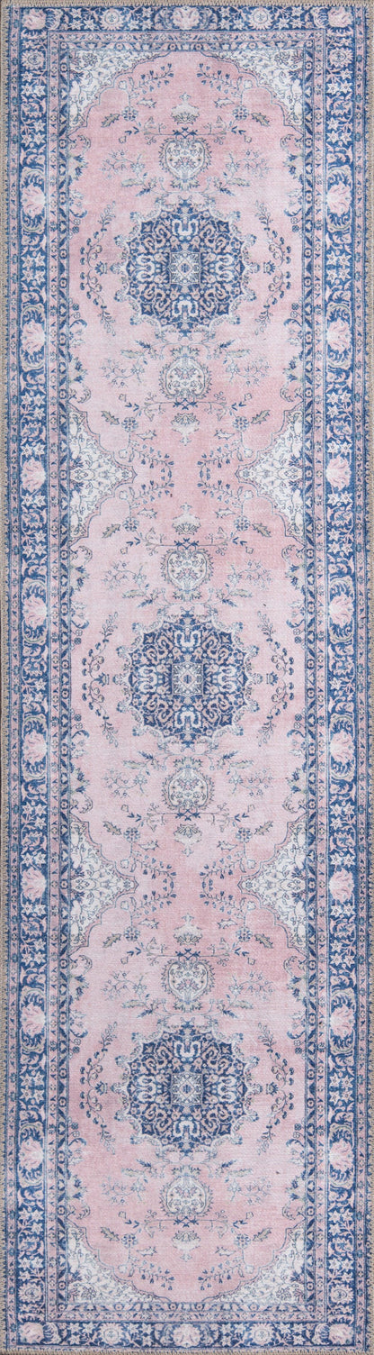 Pink field oriental runner rug with blue border and intricate floral medallions.