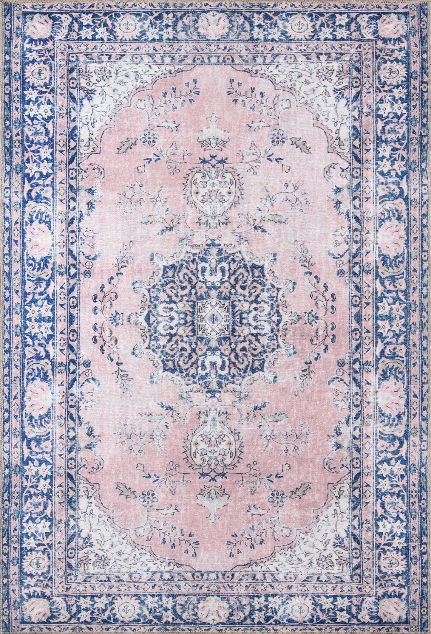 Pink oriental area rug with blue central medallion, intricate floral scrolls and blue border, vintage Persian-inspired decor