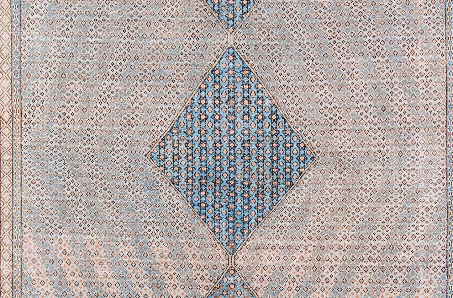 Blue diamond medallion runner with beige patterned field and border, featuring intricate geometric floral motifs.