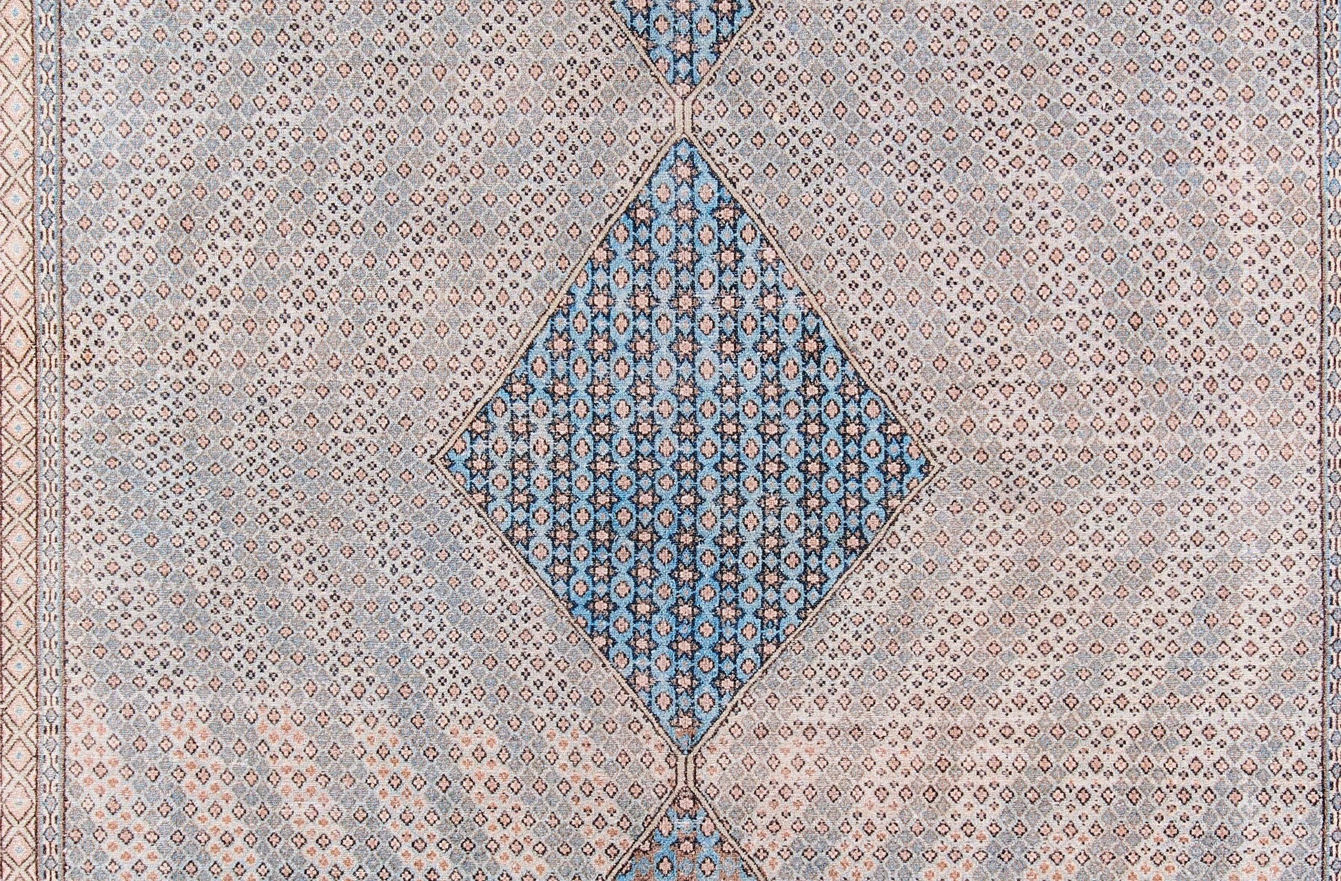 Blue diamond medallion runner with beige patterned field and border, featuring intricate geometric floral motifs.