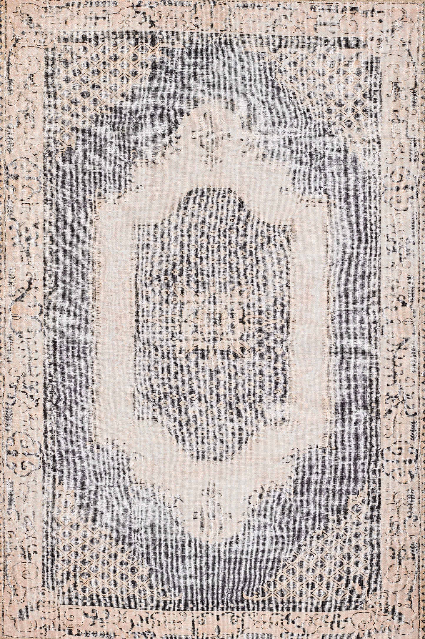 Distressed vintage oriental rug with blue-gray center medallion, ivory border, lattice corners; rectangular decorative rug.