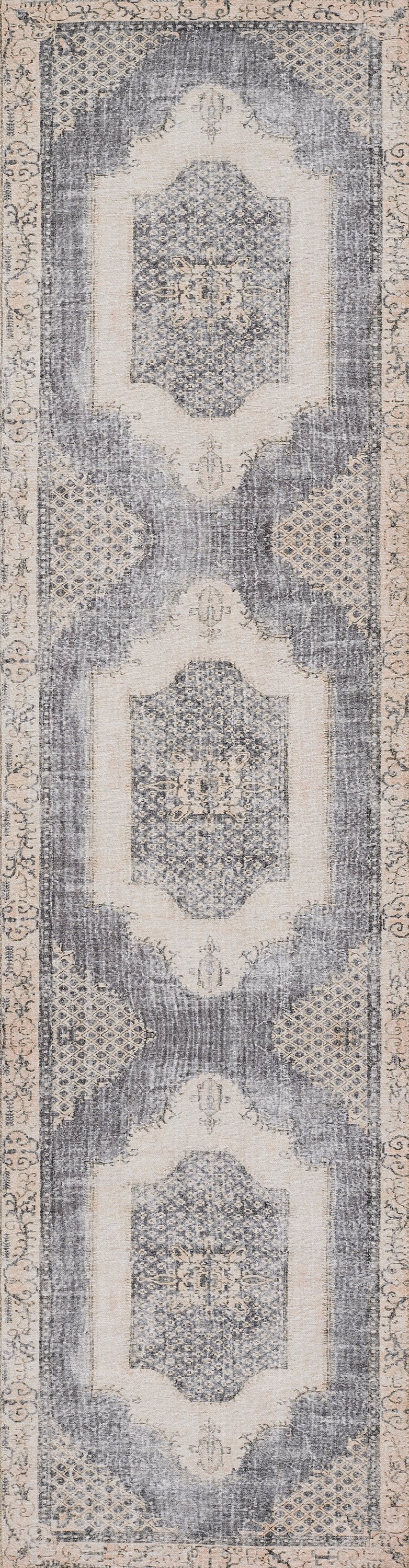 Hallway runner rug 2' x 3' with repeating geometric medallions in gray-blue and beige, bordered edges and a distressed vintage look.