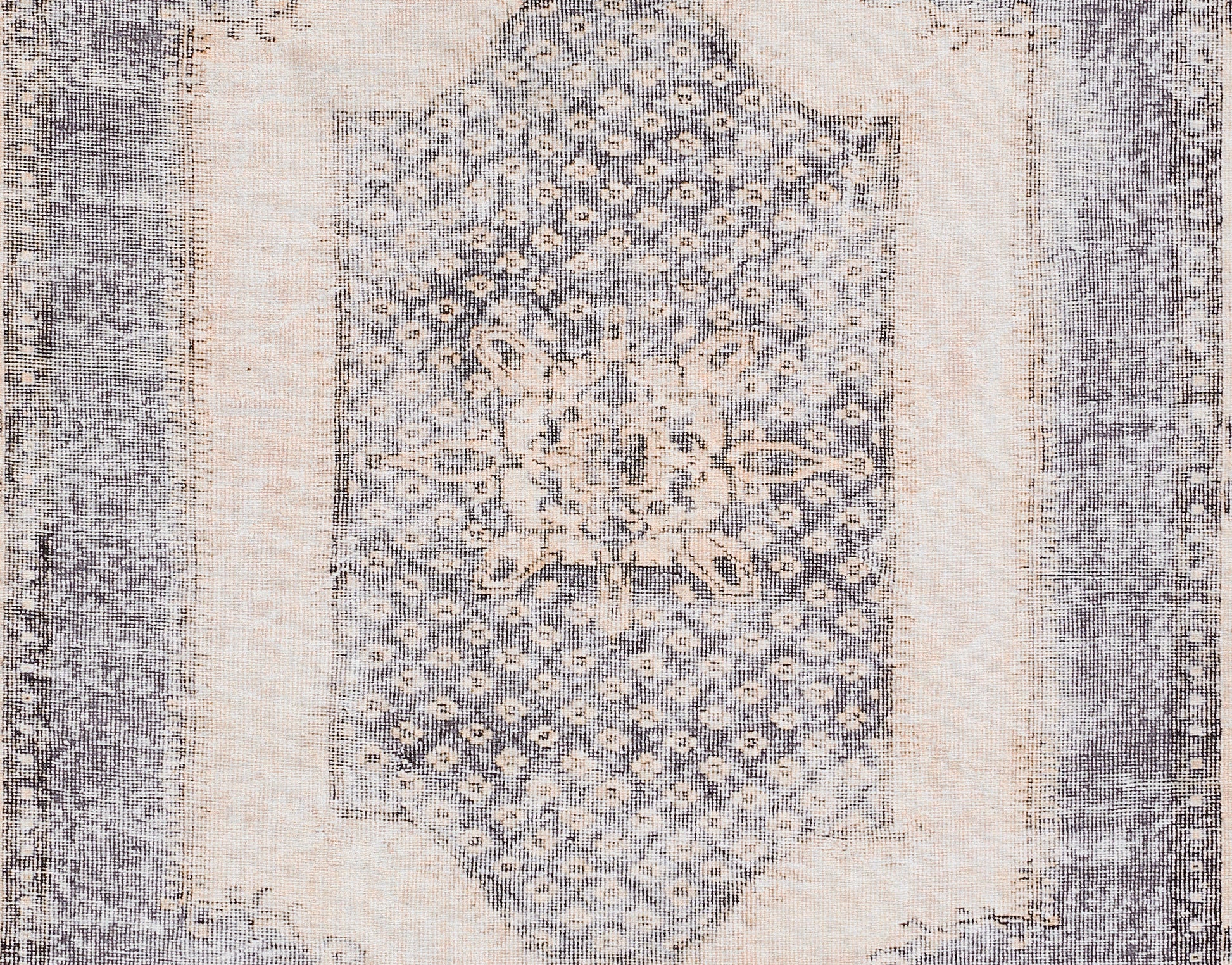 Rectangular blue & ivory distressed rug with central floral medallion and ornate border.