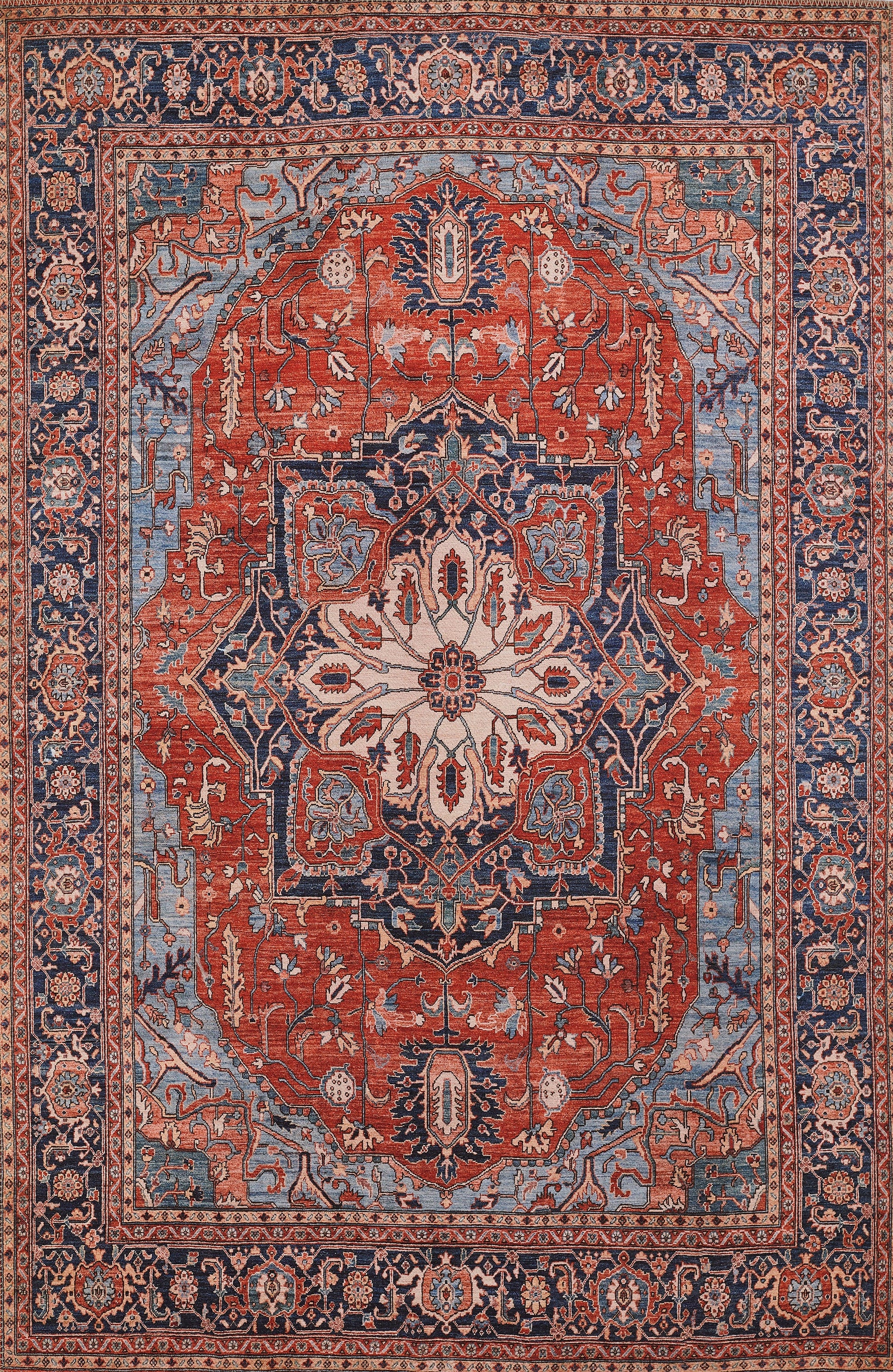 Persian-style rug with red field, ivory central medallion, and blue borders; intricate floral arabesque pattern.