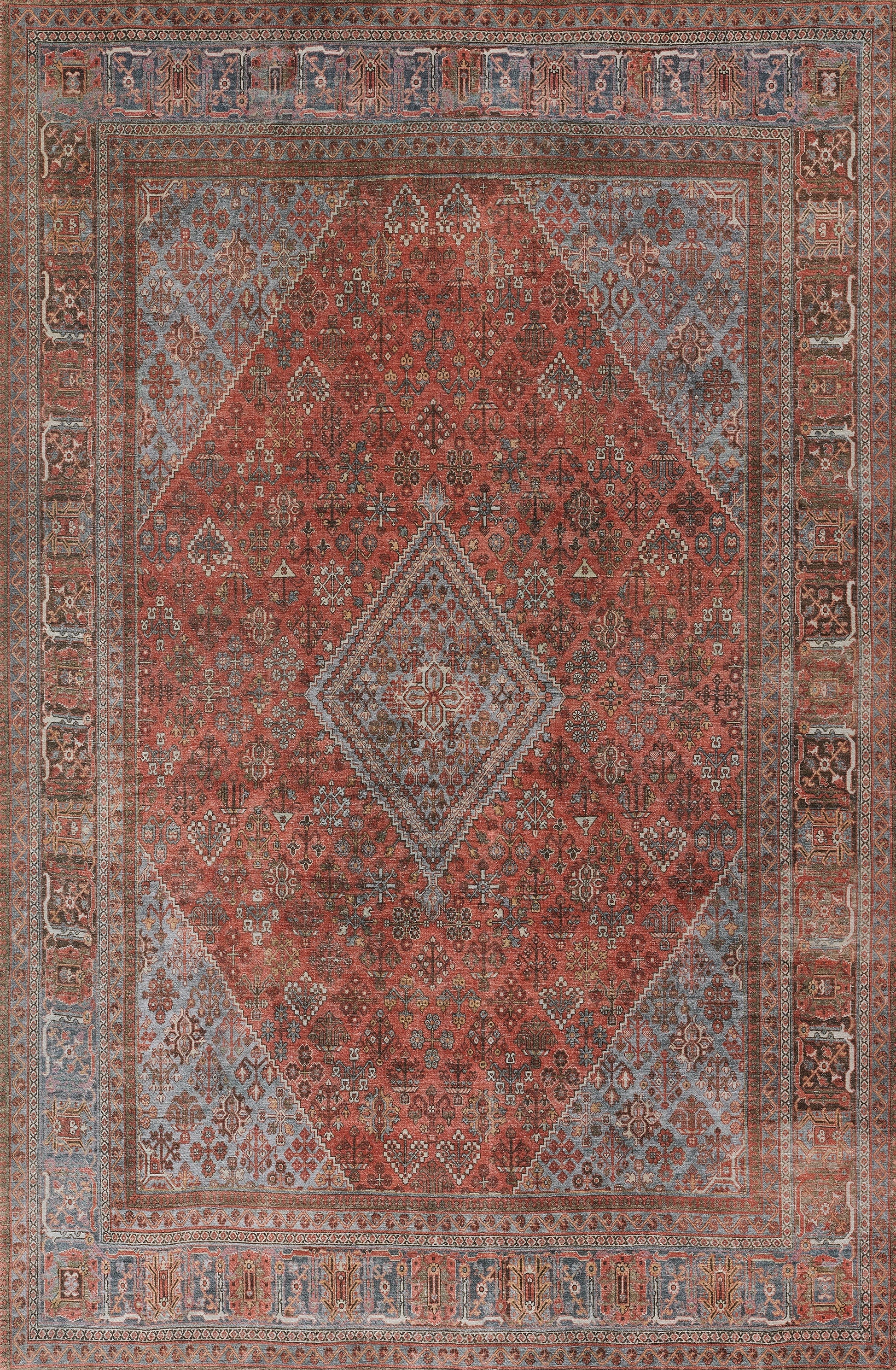 Persian-style distressed wool rug, red field with central diamond medallion, blue borders, intricate floral motifs.