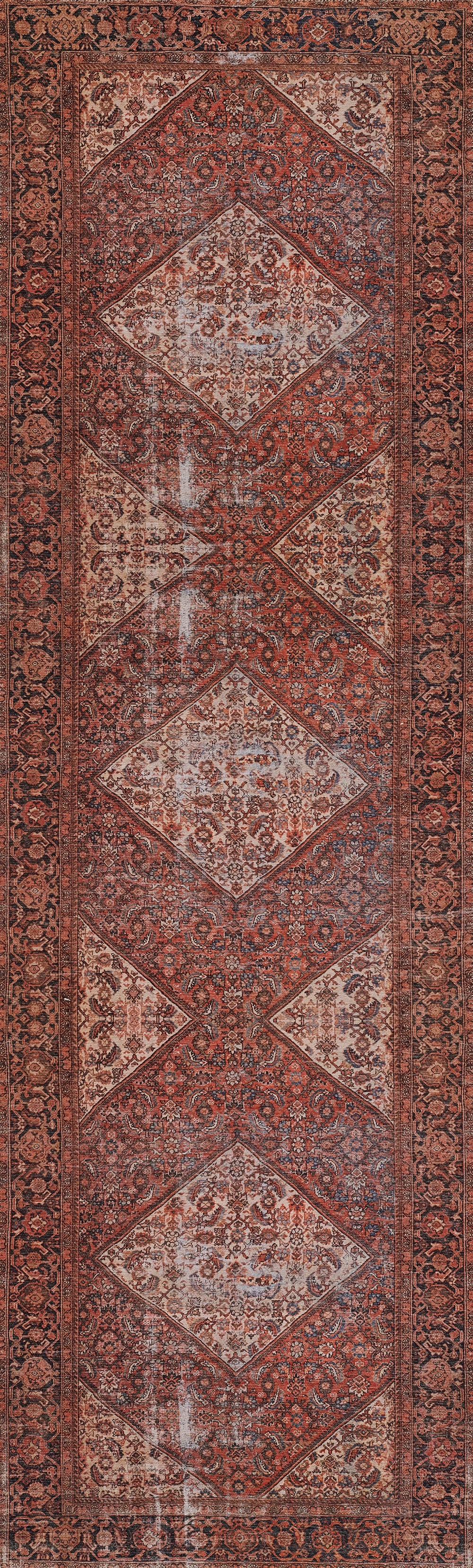 Persian-inspired red rug with large diamond medallions and ornate borders.