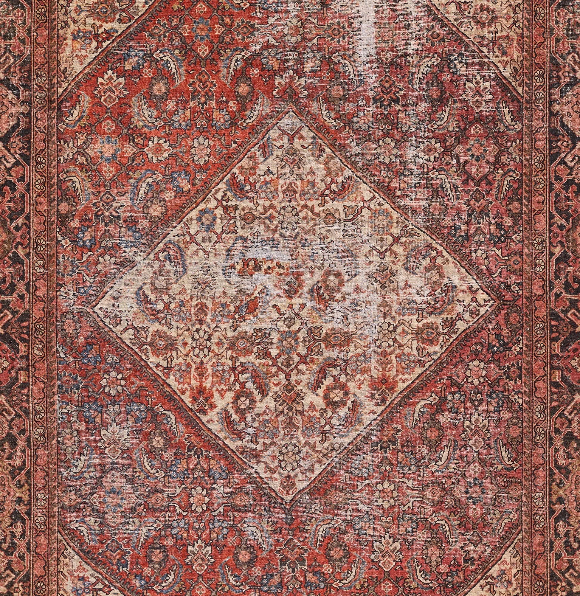 Red Persian-style rug with a diamond cream central medallion, dense floral motifs and ornate borders.