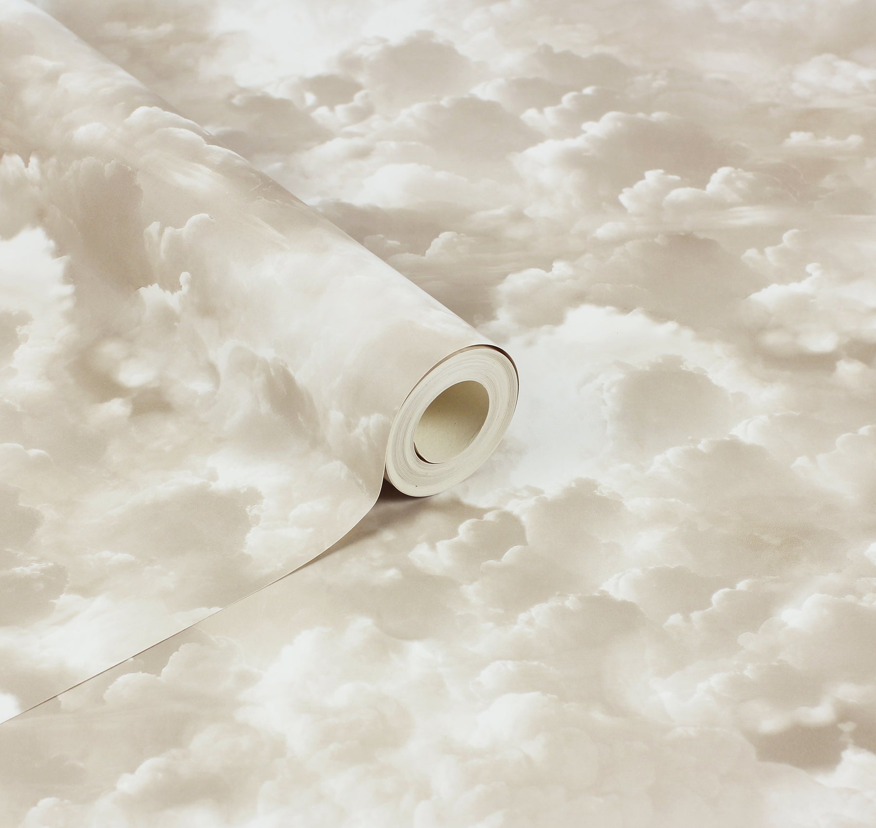 Beige cloud-pattern wallpaper roll, cream and tan hues, partially unrolled.