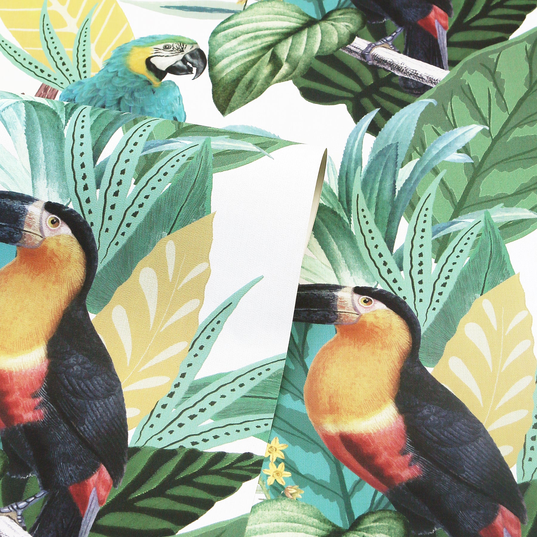 Bright tropical print with toucans among large green and teal leaves, yellow accents; bold jungle foliage design.