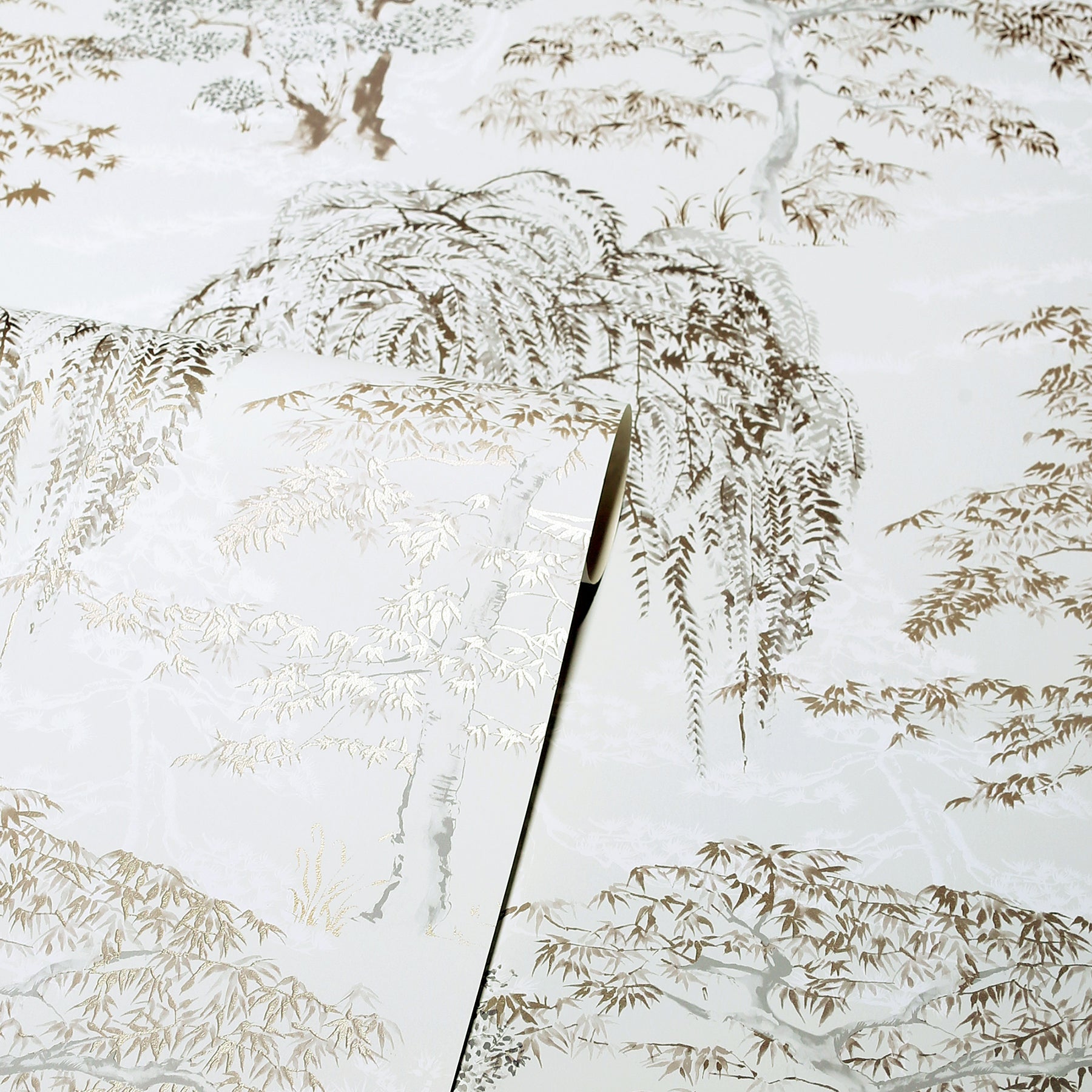 Close-up frosted glass panel with beige fern print and a diagonal seam between panes.