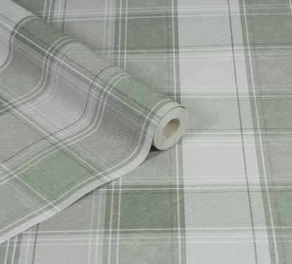 Close-up of green and white plaid fabric roll with folded edge; checkered textile for upholstery or crafts.