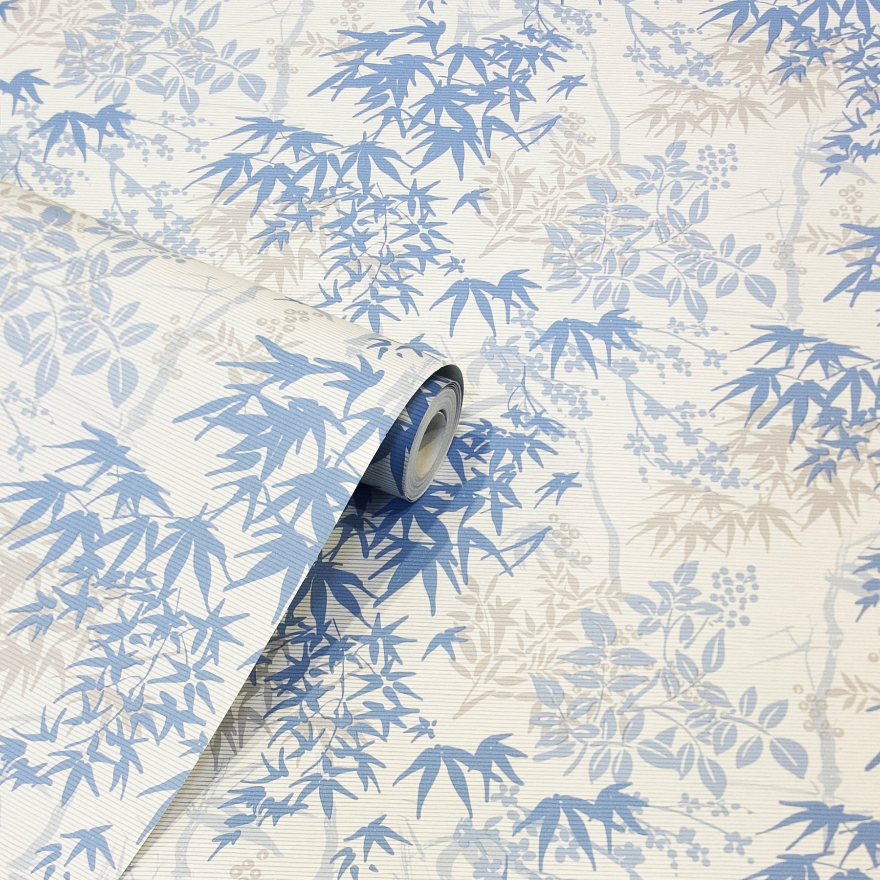 Blue and beige bamboo leaf wallpaper roll with a botanical pattern and rolled edge.